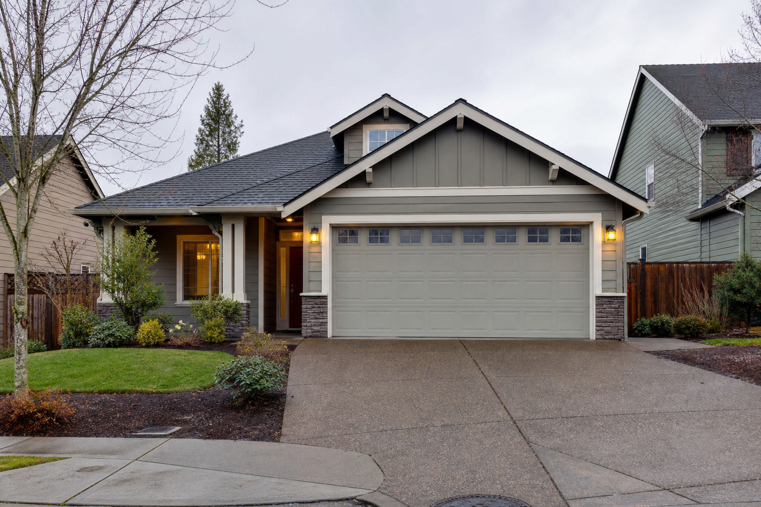 Suburban Vancouver WA home with a full garage door visible from the driveway